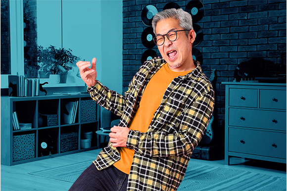 A man playing the air guitar 