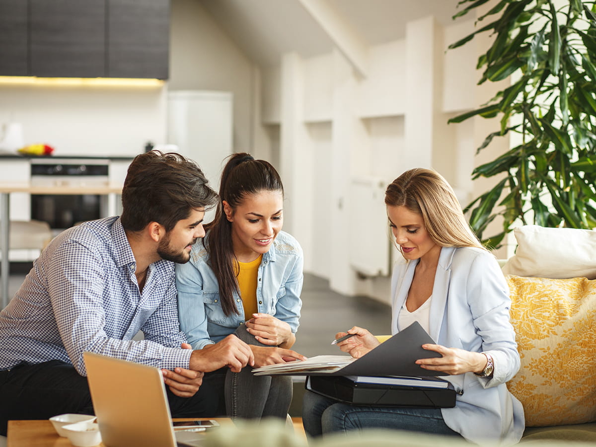 Couple sitting with an advisor in an office
