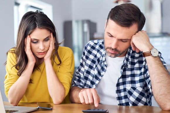 man and woman figuring out their budgeting,  money impacts relationship