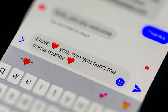 A phone displaying a text message scam