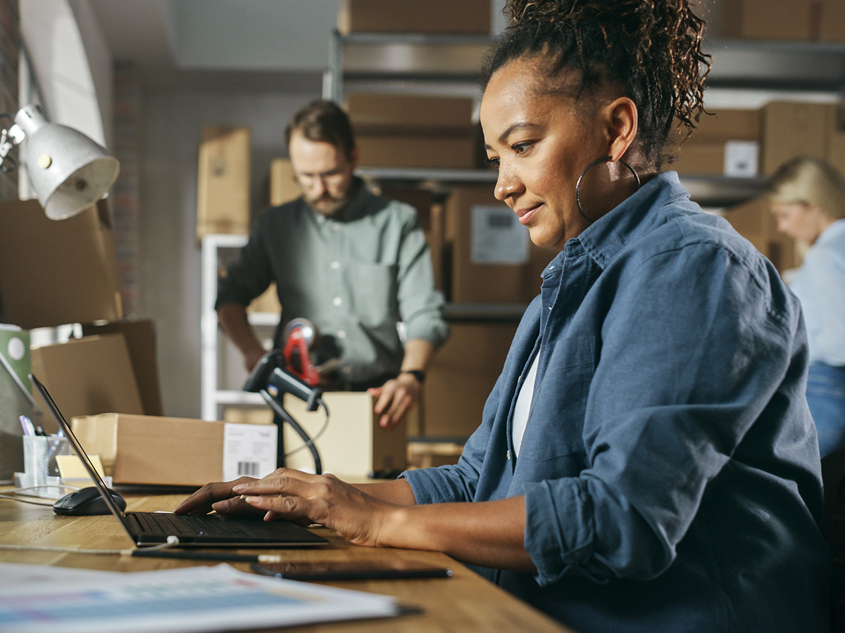 Woman and a man working at their business 